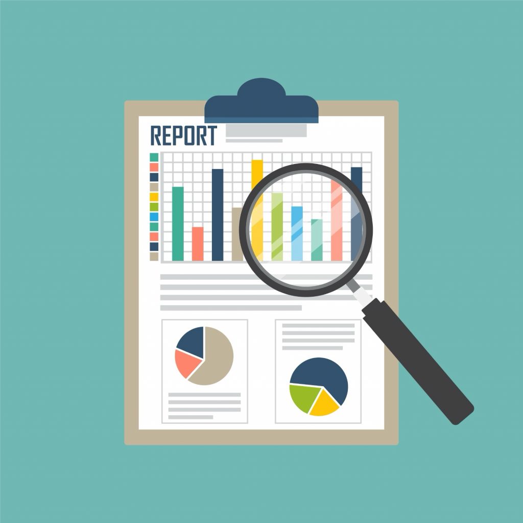 Magnifying glass over clipboard